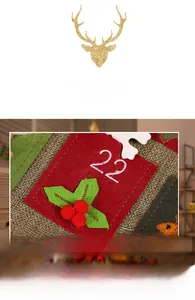 Detail of burlap advent calendar showing red pocket number 22 with green felt leaf