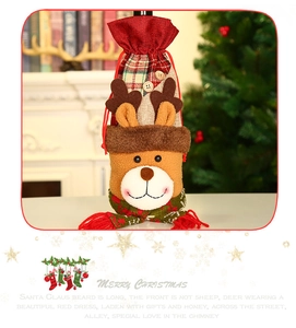 Detail of reindeer wine bottle cover with plaid scarf and drawstring for Christmas table