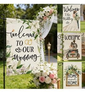 Detail of linen texture wedding garden flag with lily flowers and welcome message