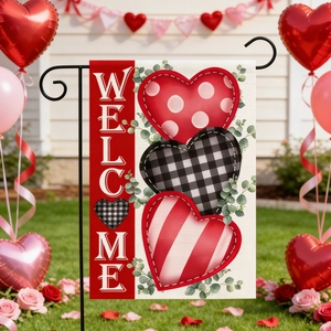 Outdoor Valentine's Day garden flag with Welcome text, hearts and iron stand on grass