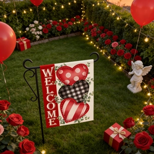 Close-up of double-sided linen garden flag with hearts and metal stand in cozy garden