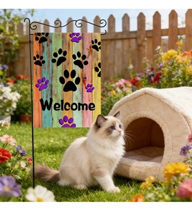 Linen garden flag with paw prints and welcome text displayed on a black metal stake