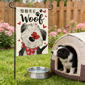 Garden flag with heart paw print and You Had Me At Woof text on iron stand