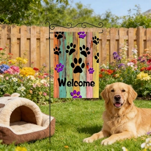 Linen pet garden flag with paw prints and Welcome text displayed on a sunny lawn