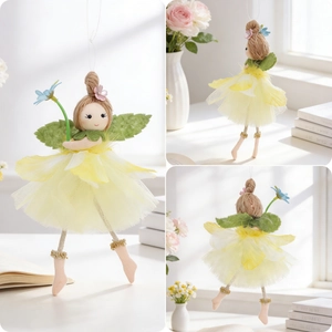 Detail view of Easter angel girl ornament with yellow mesh skirt and green leaf wings