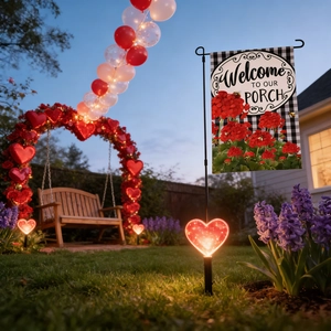 Outdoor Valentine garden flag with buffalo plaid and red flowers in a sunset porch setting