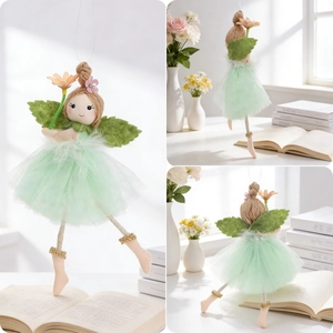 Detailed close-up of a mint green fairy angel doll ornament with tulle skirt and wings