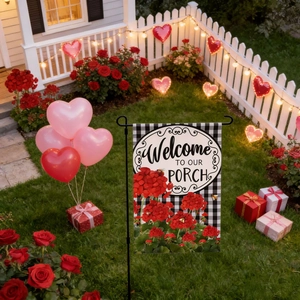 Detail of Valentines garden flag with red geraniums and Welcome TO OUR PORCH message