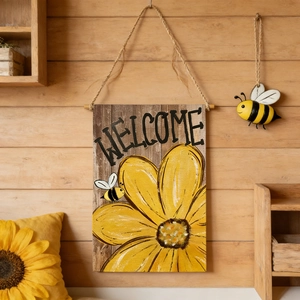 Detail of wooden welcome sign featuring sunflower bee design on rustic wall decor