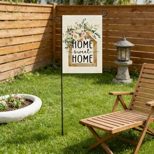 Close-up of linen garden flag with Home Sweet Home print and metal hanger stand
