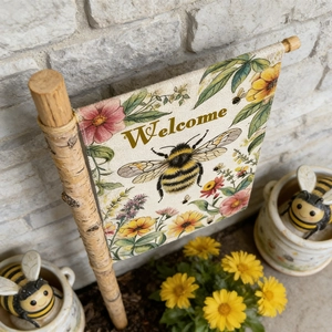 Detail of linen garden flag with sunflowers, bee pattern and wooden support pole