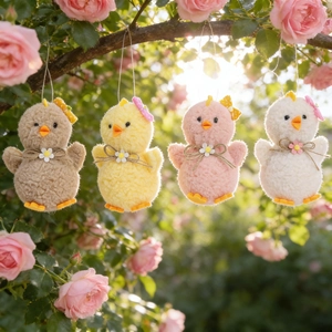 Charming plush Easter chicks with bows hanging on rose branches for party decor