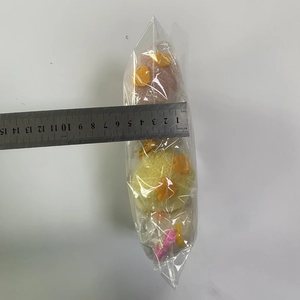 Detail showing a 5.5cm width measurement of colorful plush chick Easter hanging ornaments
