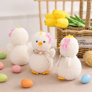 Three plush Easter chicks made of white fuzzy wool with pink bows and floral details
