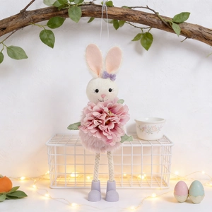 Detail of Easter bunny pendant with plush pink body and layered flower decoration