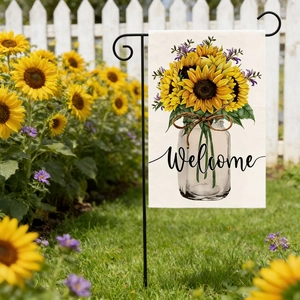 Detail of linen garden flag with sunflowers and Welcome text on a black metal stand