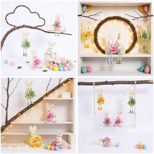 Detailed view of long-legged plush Easter bunny pendants with colorful flowers