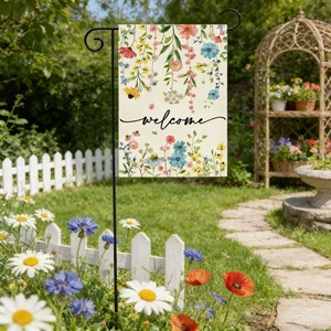 Linen garden flag with watercolor flowers and welcome text hanging on a black metal pole