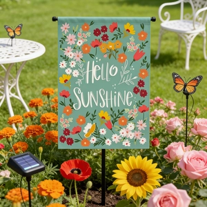 Close-up of Hello Sunshine linen garden flag with floral patterns and metal hanger