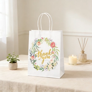 Floral gift bag detail with watercolor flower ring and golden Thank You script