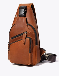 Detailed view of vintage brown crazy horse leather chest bag with functional zippers
