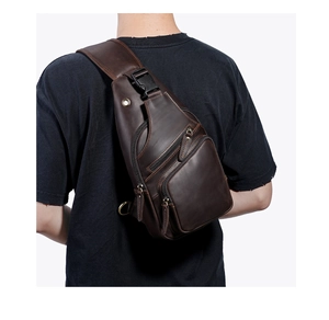 Detailed view of dark brown crazy horse leather chest bag with multiple zipper compartments