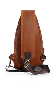 Rear view of brown crazy horse leather sling bag with adjustable straps and metal rings