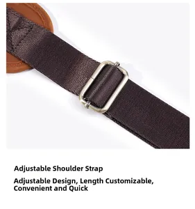 Detail of adjustable brown woven shoulder strap with retro metal buckle on leather chest bag