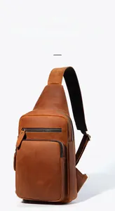 Macro detail of retro brown cowhide leather chest bag with premium metal hardware accents