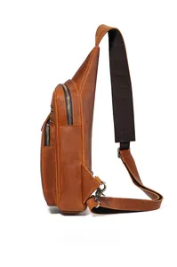 Detail view of genuine leather chest bag showing three zipper layers and vintage texture