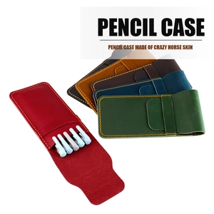 Detail of vintage crazy horse leather pencil cases in multiple colors with hand-stitched seams