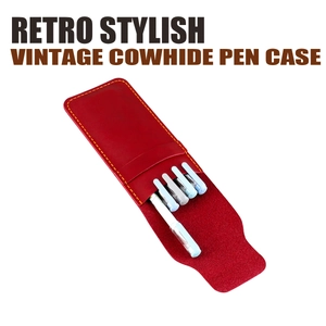 Detail view of red vintage cowhide leather pen case with yellow stitching and five pens