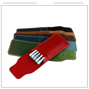 Macro detail of crazy horse leather pen pouches showing multi-color options and hand stitching