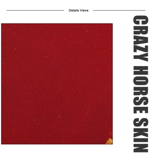 Detailed texture of dark red crazy horse leather showing the natural grain and matte finish