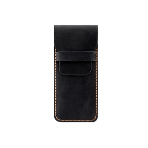 Macro shot of black crazy horse leather pen pouch with orange contrast stitching details
