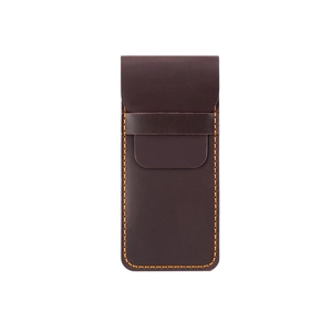 Detail of vintage dark brown leather pen case with contrast orange stitching and strap
