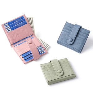 Litchi pattern leather bifold wallets in pink, blue, and green with RFID card slots