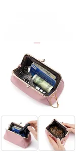 Macro shot of pink lychee leather coin purse with vintage gold clasp and inner storage space