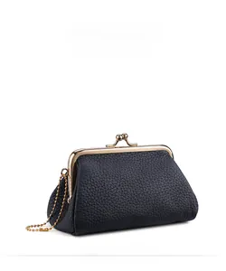 Close-up of black lychee grain leather coin purse with gold metal clasp and chain
