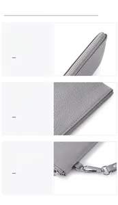 Detailed view of grey pebble leather wallet showing metal zipper and detachable clasp hook