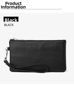 Detail of black pebbled leather clutch featuring silver zipper and wristlet strap