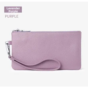 Lavender purple pebble grain leather wristlet bag with silver zipper and wrist strap