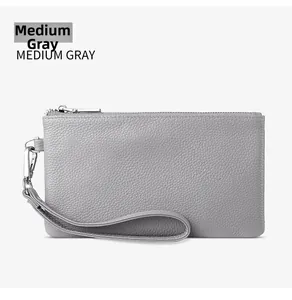 Detail of medium gray pebble grain leather clutch with silver zipper and wrist strap