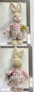 Detail view showing front and back of plush Easter bunnies in pink floral outfits