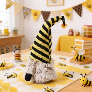 Detail of bee festival gnome featuring a yellow striped hat and plush grey body decoration
