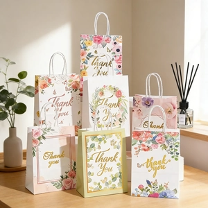 Set of 7 floral paper gift bags with handles and golden Thank You typography print