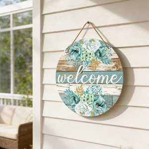 Detailed close-up of a floral round wooden welcome door sign on a white wall