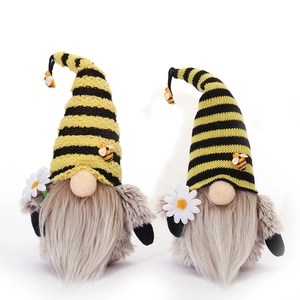 Pair of Bee Day gnomes with yellow striped hats and sunflowers for home decor