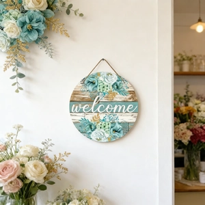 Round wooden welcome sign with blue floral print and hanging rope for door decor