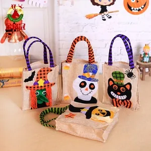 Halloween linen candy bags featuring pumpkin, witch, cat, and skull felt patchwork designs